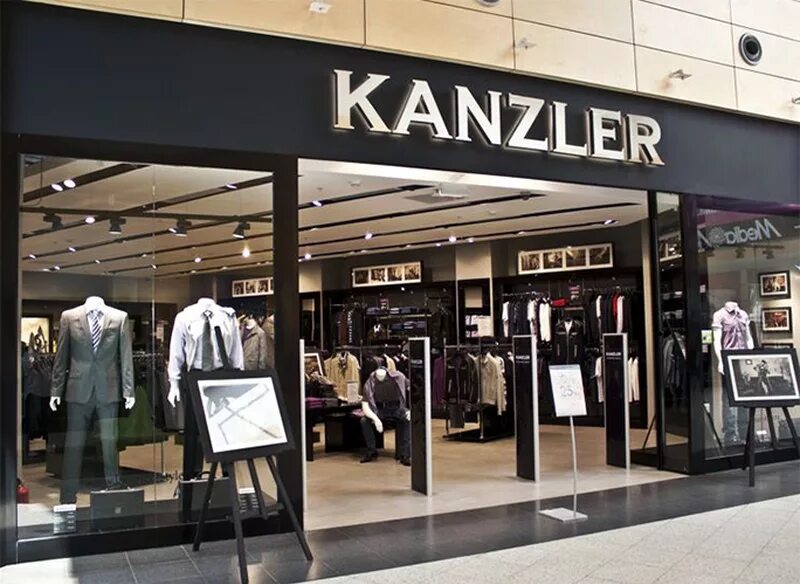 Мужские магазины тюмень. Канцлер магазин мужской одежды. Kanzler магазин мужской одежды. Мужская одежда вывеска. Магазин мужской одежды вывеска.