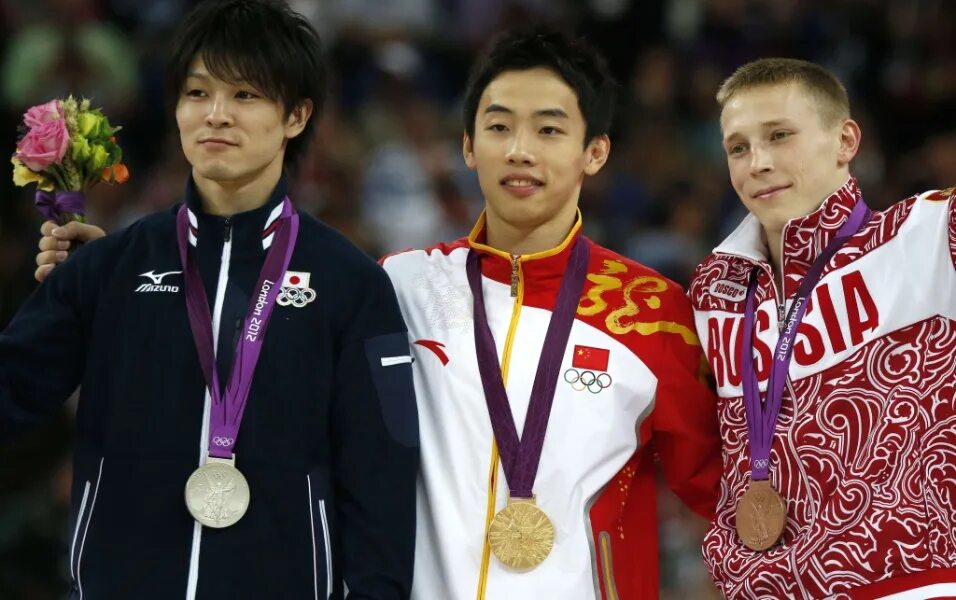 Спортсмены защищают честь. Кахеи Учимура. Японские спортсмены. Японские атлеты.