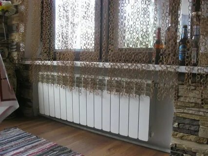 Шторы закрывают батареи