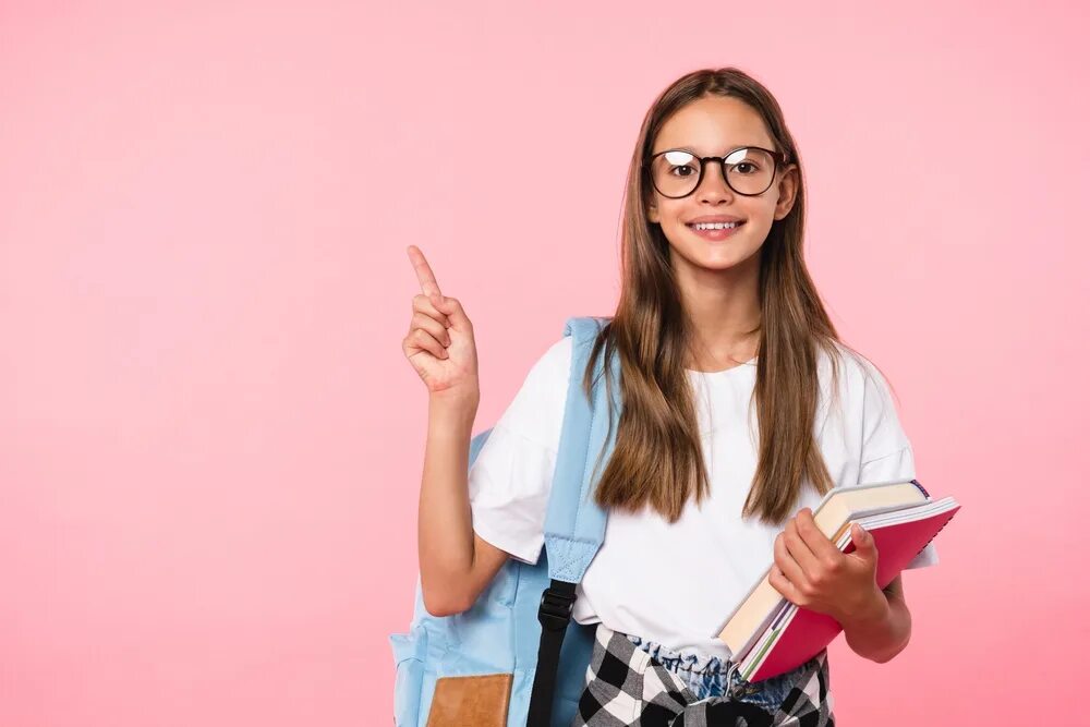 She a good student. Show me copy book фото. Stock-Footage-a-schoolgirl-student-with-a-Backpack-on-her-back-strolls-along-the-Embankment-after-School. Pointing to subject. Girl with textbooks points her finger.