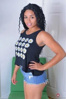 Pretty ebony Millie Stone spreading her exotic shaved pussy wide open up cl...