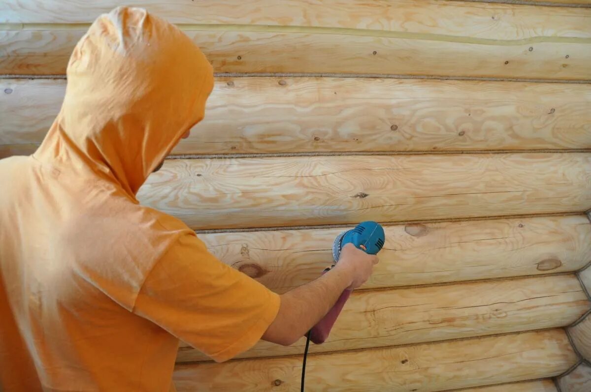 Чем можно обработать дом. Шлифовка деревянных стен. Шлифовка деревянного сруба. Шлифовка сруба из бруса. Краски для деревянной бани.