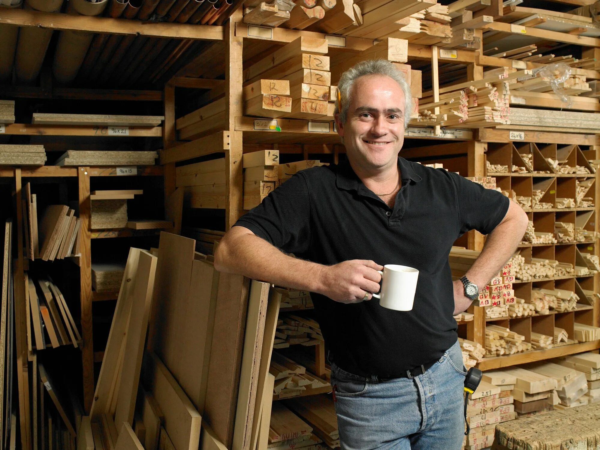 Man with Lumber. Man holding Wood.