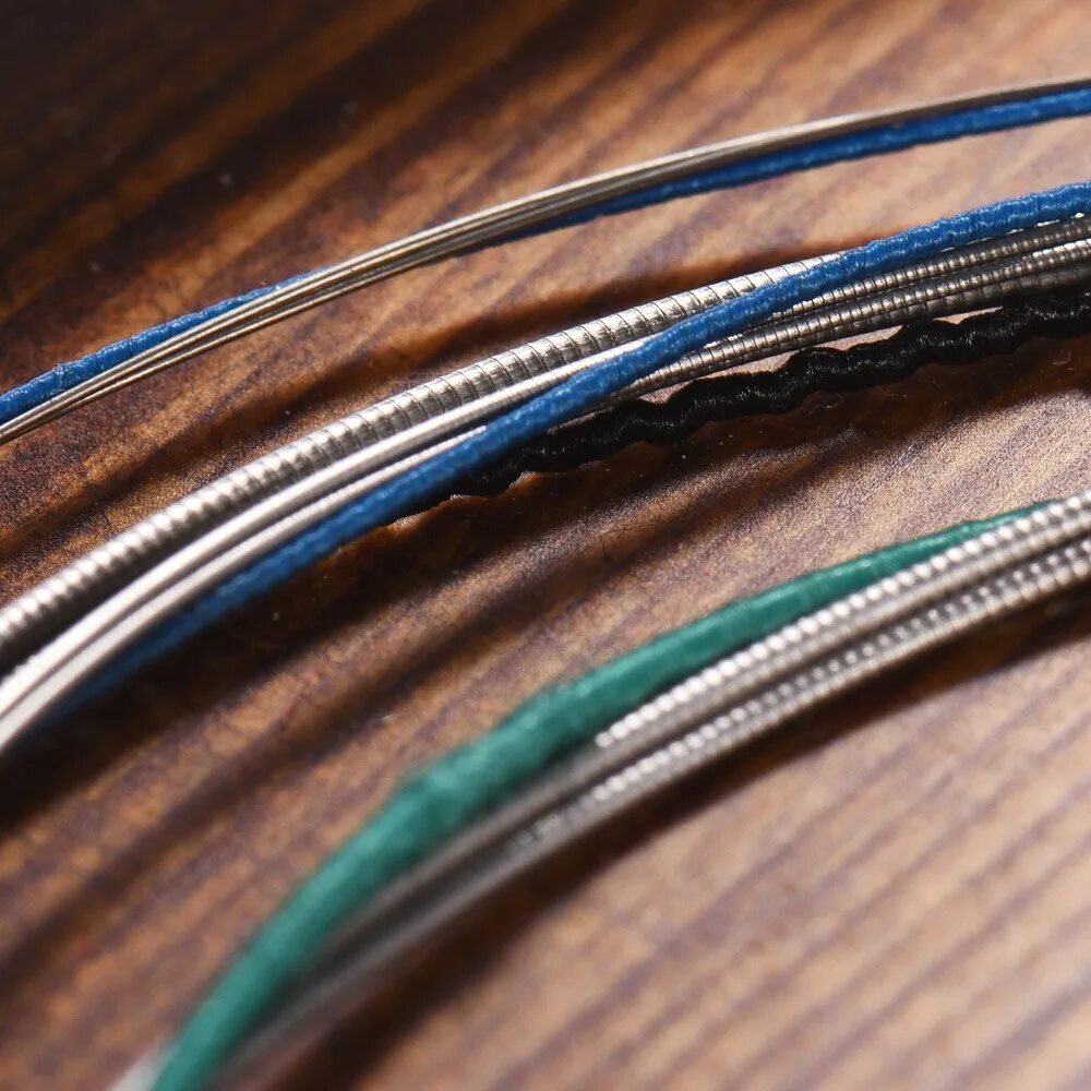 нейлоновые струны для бас гитары. струны alice a703. оплетка струны. струны с плоской обмоткой для бас гитары. струны 12 калибра.