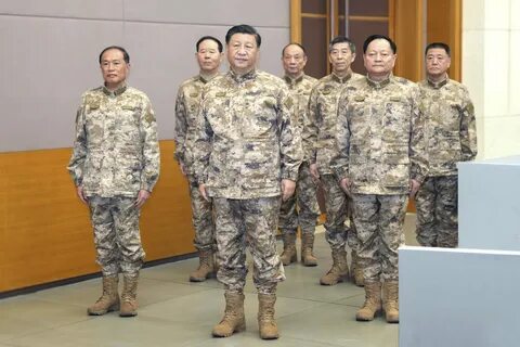President Xi Jinping (front centre) stands with the members of the Central Military...