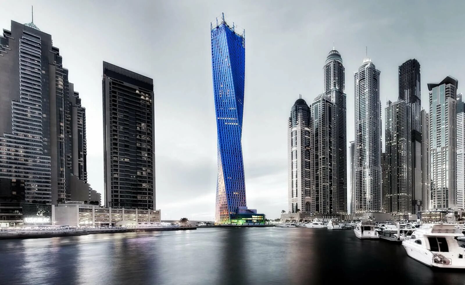 Как называются здания в городе. Кайан Тауэр. Cayan Tower Дубай. Инфинити Тауэр Дубай.