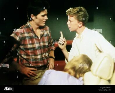 SIXTEEN CANDLES, standing from left: Michael Schoeffling, Anthony Michael Hall, 