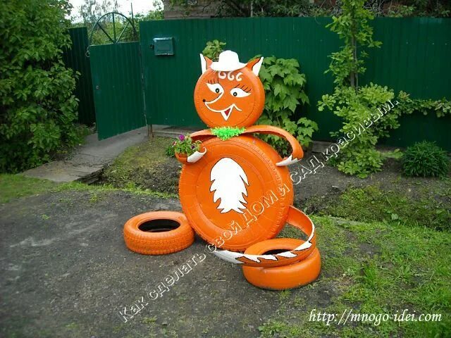 Клумба лиса из покрышек фото