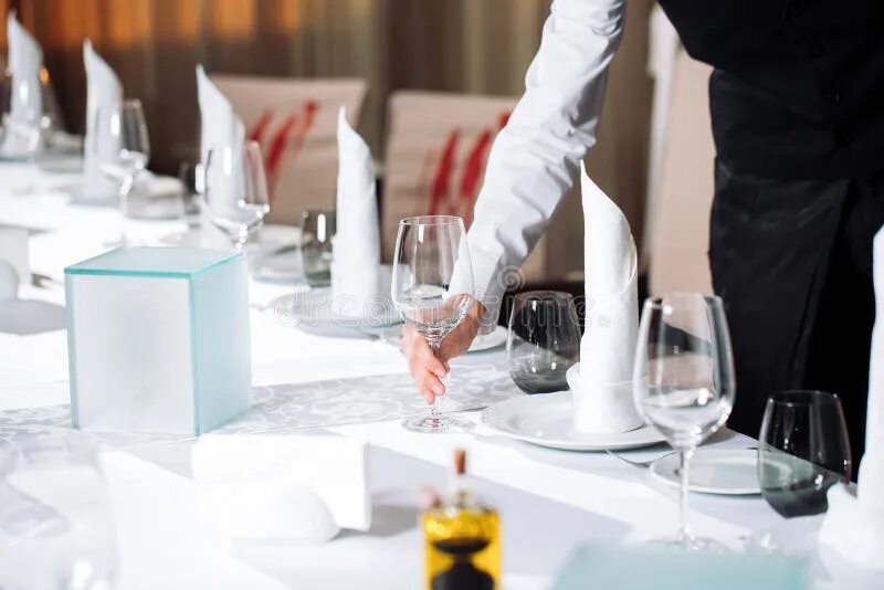 All in the serve. Restaurant table serving. served table. table service. waiter setting table.