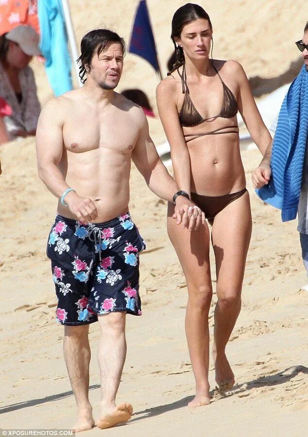 Mark Wahlberg gets to work on those tan lines during Hawaii beach outing Daily M
