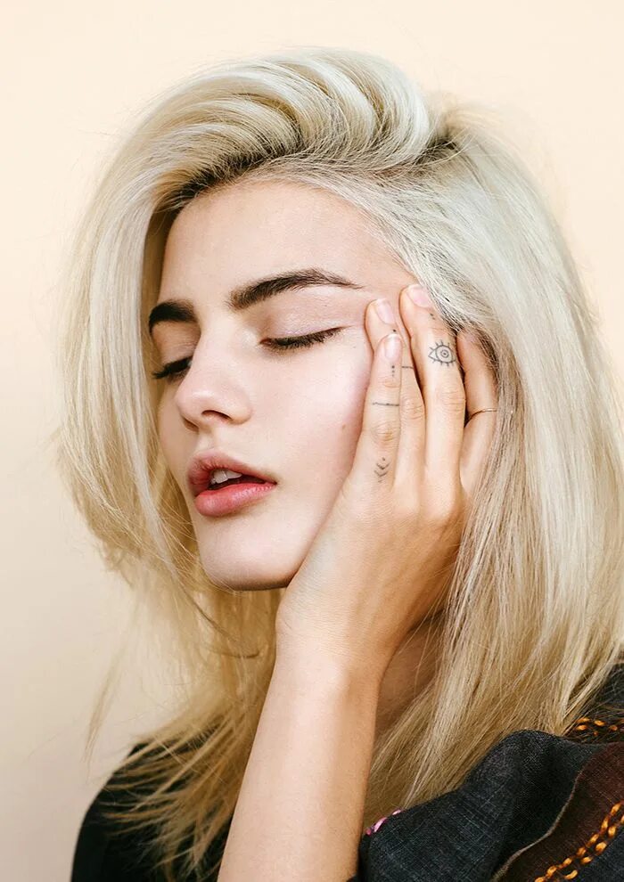 Cara Delevingne sports pale face and cropped hair as she tries out a spooky new 