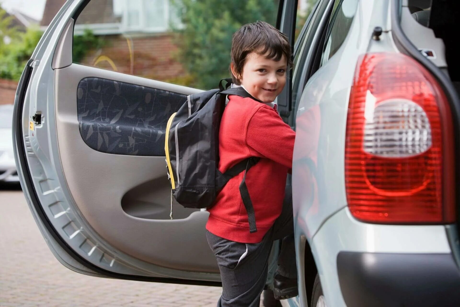 Get into a car. Child in the back of the car. Go to School by car. Going to School in a car. Kid lock