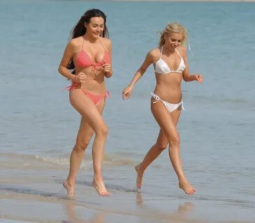 SARAH GOODHART and HOLLY RICKWOOD in Bikinis at a Beach in Ibiza 06/07/2017...