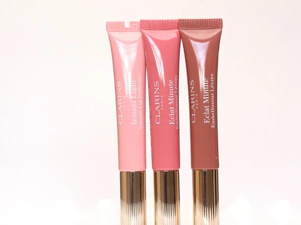 Блеск clarins eclat minute 05 свотчи. Candy shimmer clarins. Clarins 01 rose shimmer. Clarins 05 candy shimmer. Clarins natural lip perfector 05.