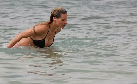 Busty milf Michelle Hunziker (42) shows off her sexy bikini body during vac...