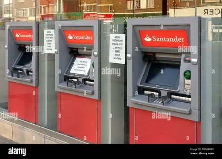 London, United Kingdom - April 09, 2020: Three Santander bank ATM withdrawa...