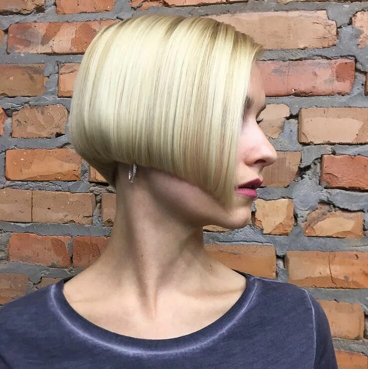 This timeless chic milk chocolate blunt bob haircut with a center part is defini