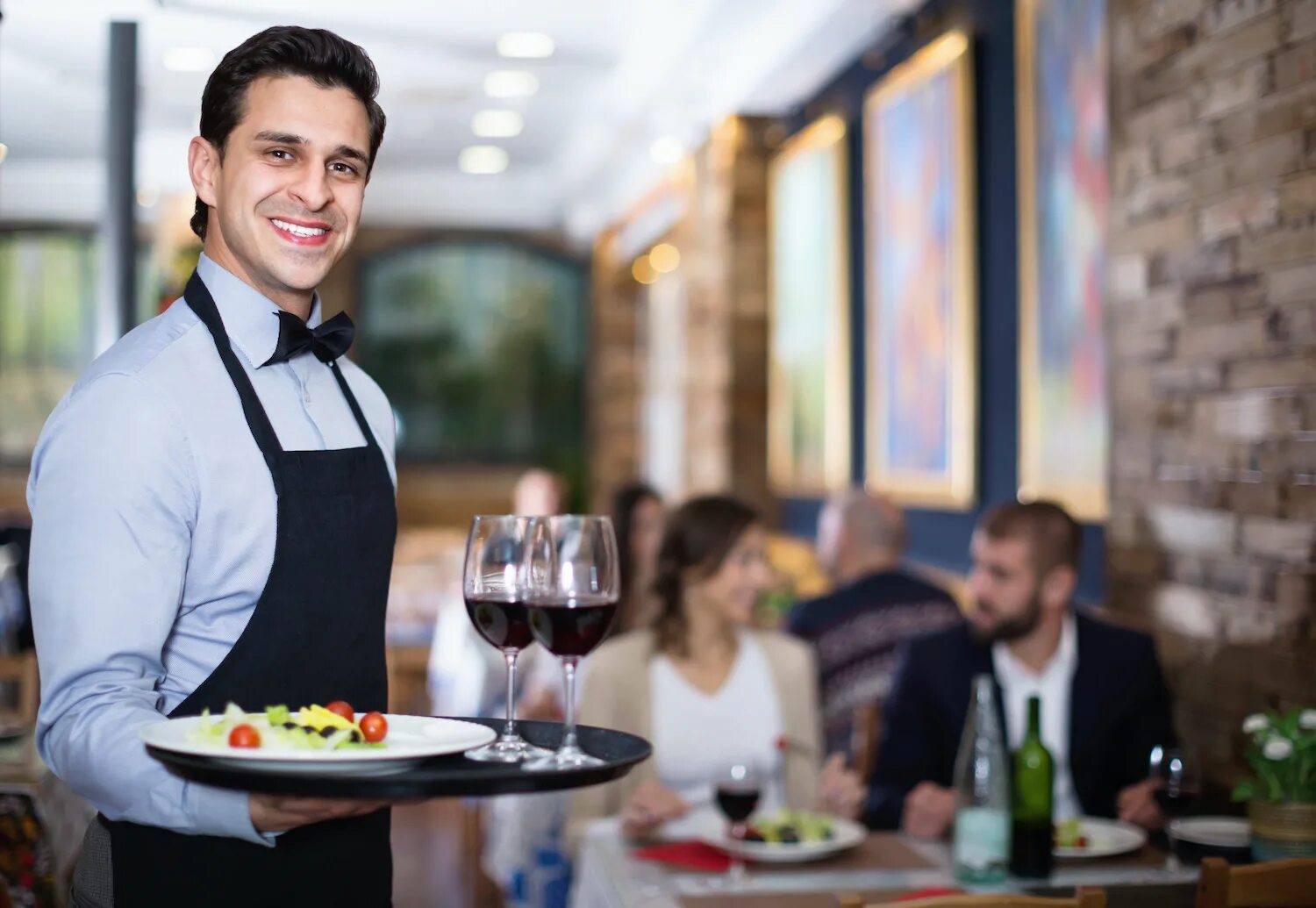 Guests rest. Waiter pose. restaurant guests.