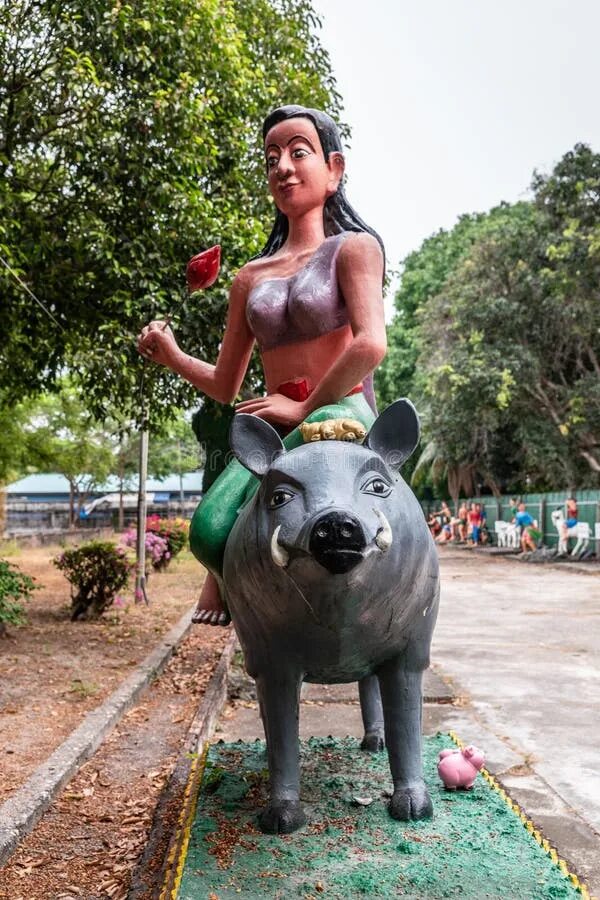 Pig riding. Woman riding piggy.