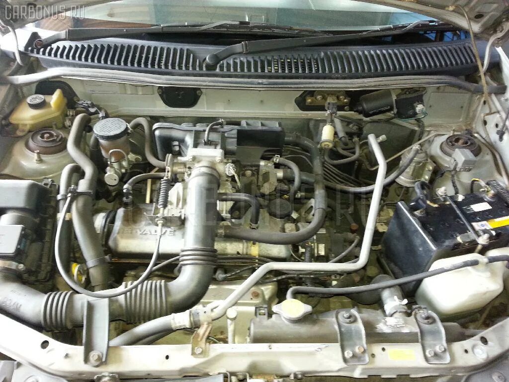 Двигатель dw3w 1.3. Mazda Demio dw3w b3. Dw3w Mazda Demio двигатель. Двигатель Мазда Демио 1.3 dw3w. Mazda Demio 2001 под капотом.
