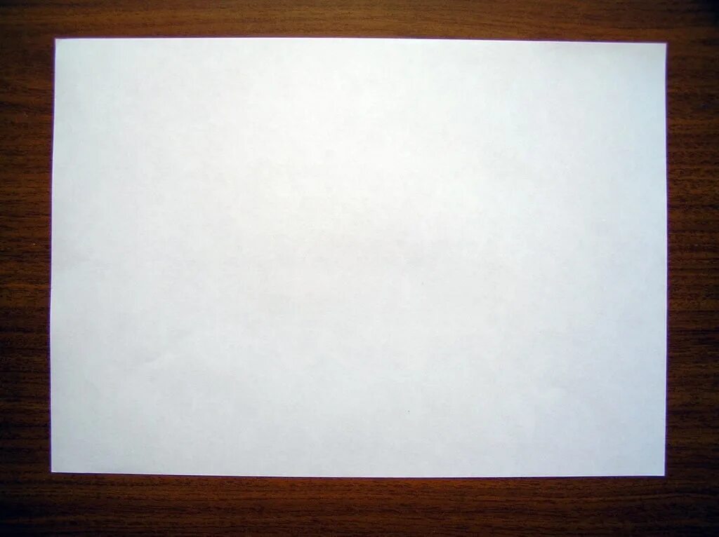 Видна а4. Чистый лист бумаги. Пустой лист. Белый лист бумаги. Лист бумаги на столе.