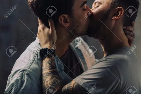 Sensual Gay Males giving deep kiss, embracing, feeling passion and love, po...