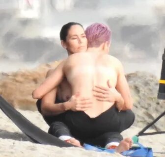 Megan Rapinoe and Sue Bird topless on the beach.