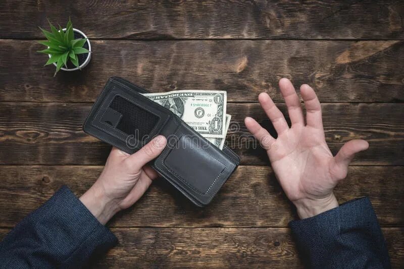 Empty wallets. Lack of money. пустой портмоне на фоне строящегося дома. a guy with an empty wallet.
