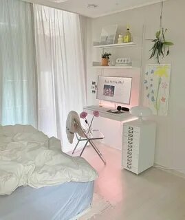 a bedroom with a bed, desk and computer 