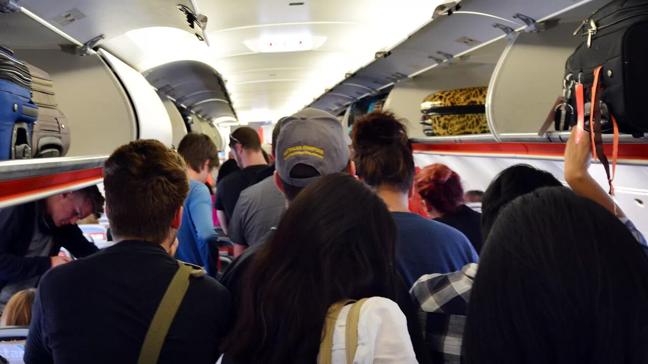 Air passengers. Мама самолет. Салон самолета с людьми. Window seat в аэропорту. Стюардесса с тележкой в самолете.