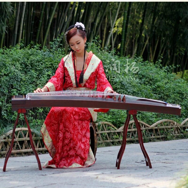 Хороший китайский инструмент. Гучжэн цитра. Гучжэн, «китайская цитра». Гучжэн, «китайская цитра» зелёная. Гучжэн музыкальный инструмент.