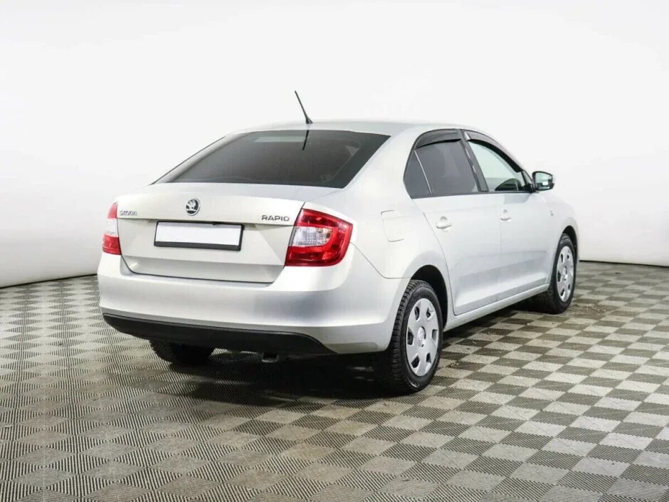 Купить рапид шкода у официального. Skoda Rapid 2014. Шкода Рапид 2014 года белая. Škoda Rapid 2014. Skoda Rapid 105 л.с.