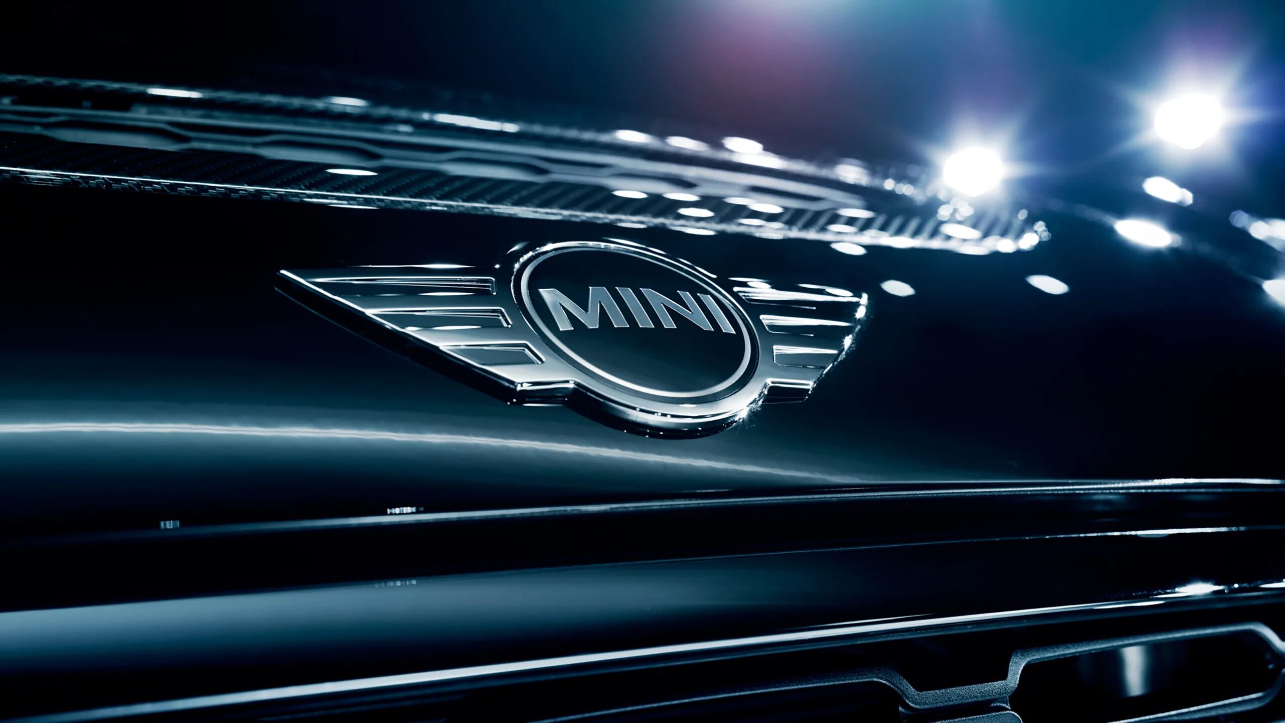 Мини логотипы. Mini cooper логотип. обои логотипы автомобилей. логотипы автомобиля мини. фон с логотипами автомобилей.