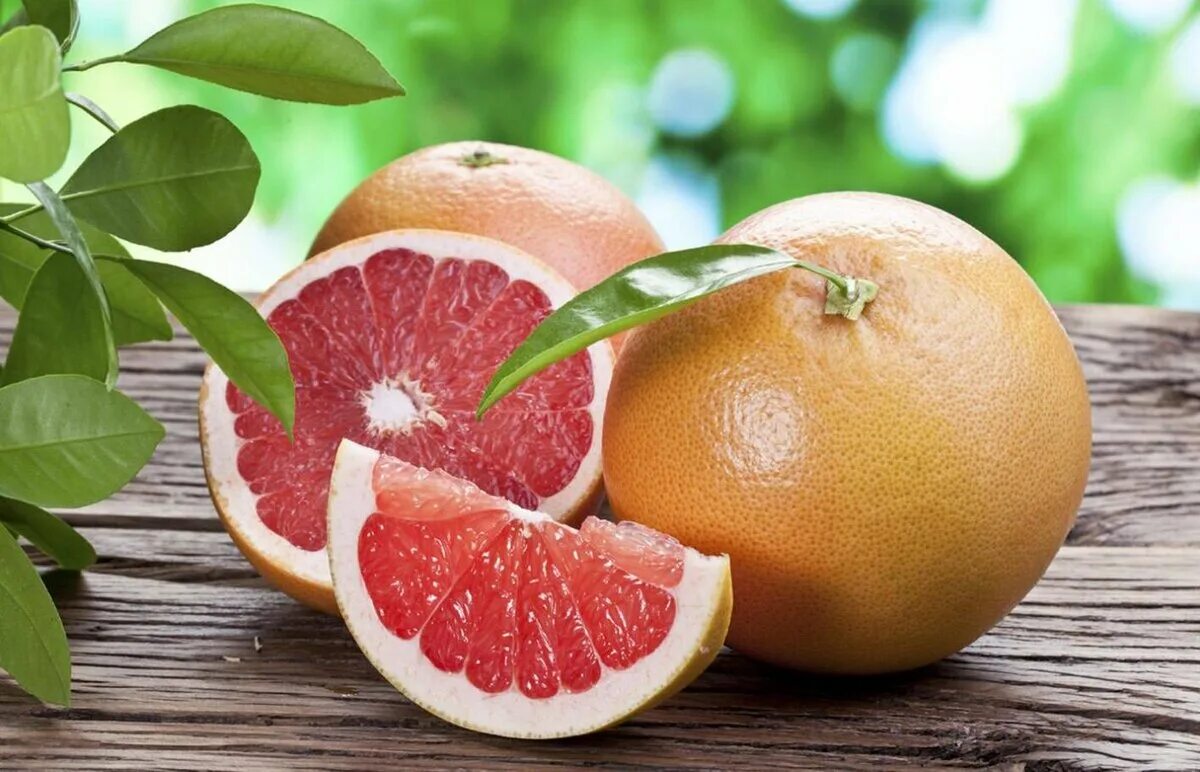 Цитрус парадизи. Грейпфрут на ветке. Грейпфрут гроздь. Гроздья грейпфрута. Грейпфрут на ветке.