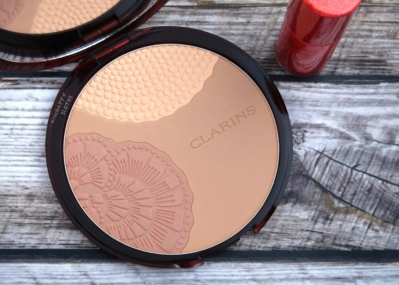 Пудра бронзатор clarins. Clarins bronzing compact коллекционная бронзирующая пудра. Clarins bronzing compact powder limited edition. Бронзатор кларанс. Бронзирующая пудра кларанс.