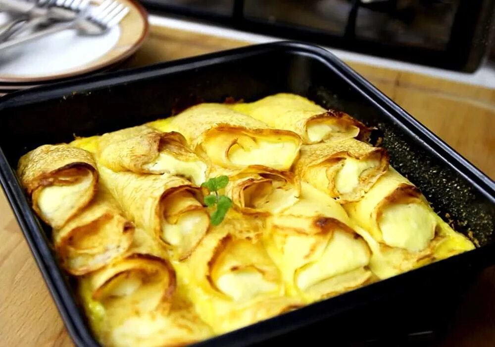 Запечь налистники. Украинские налистники с творогом запеченные в духовке. Запечь налистники. Блинчики с творогом запеченные в духовке с заливкой маленькие. Налистники белорусские.