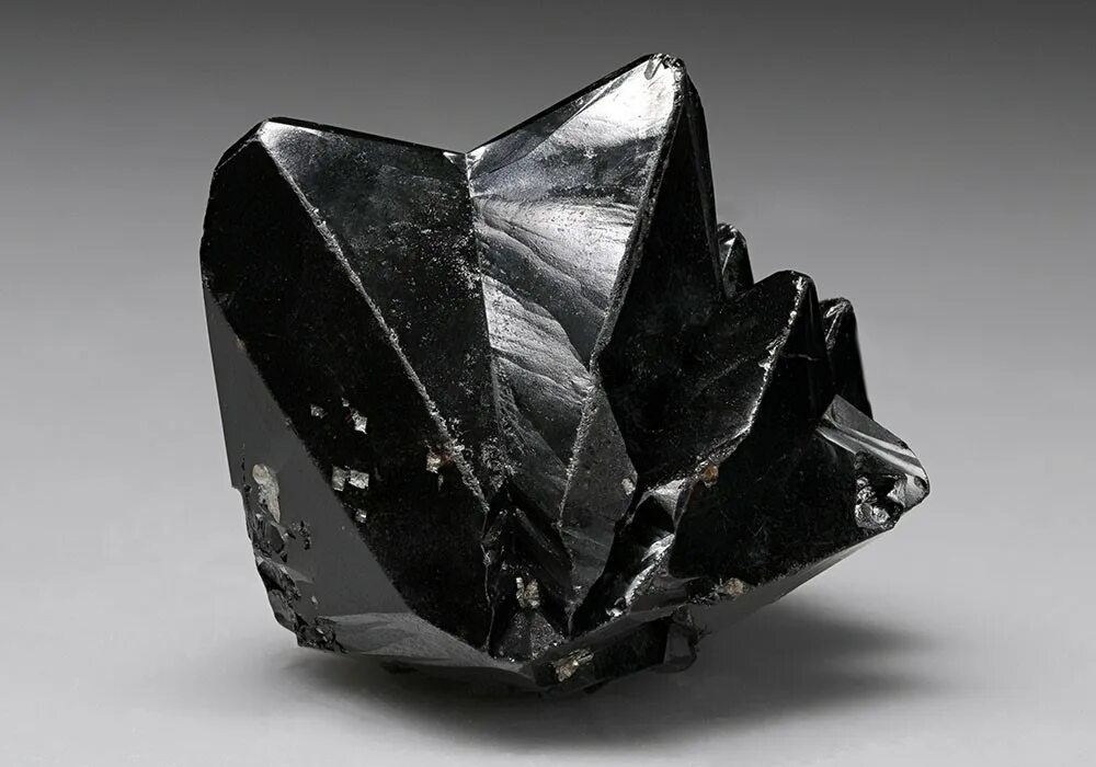 Оловянная руда касситерит. Касситерит минерал. Касситерит оловянный камень. Минерал олова касситерит.
