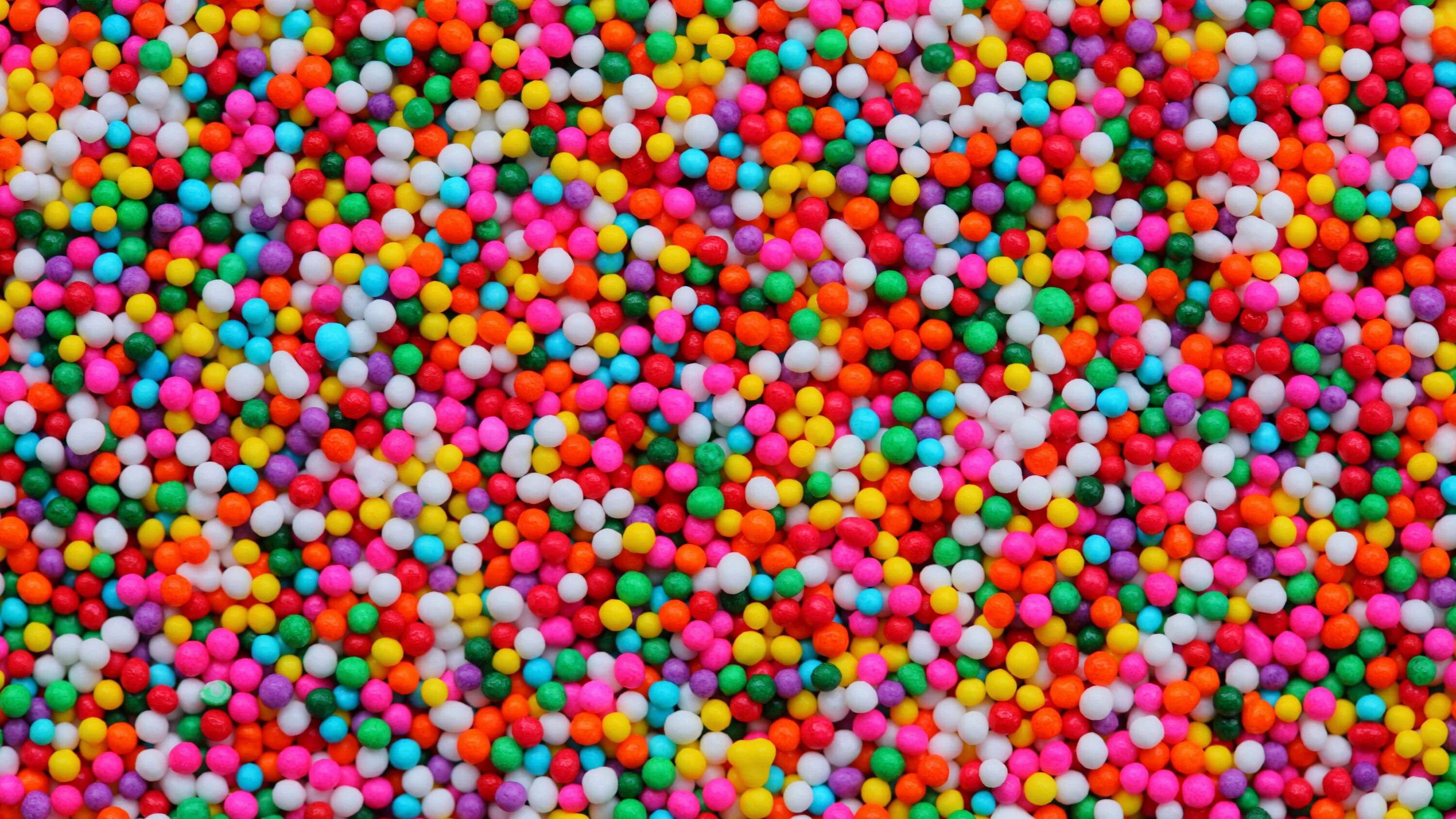 Текстура шаров. Конфеты разноцветные. Разноцветные шарики. Конфетный фон. Яркие конфеты.