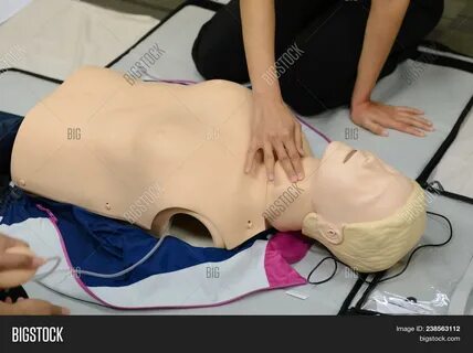 Cpr First Aid Training With Cpr Dummy In The Class.