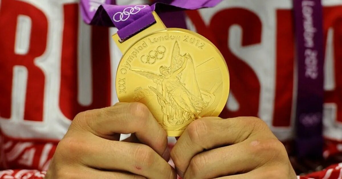 Золотые медали олимпийских игр 2012. Золотая медаль. Олимпийские медали. Олимпийские медали России. Олимпийская медаль в руках.