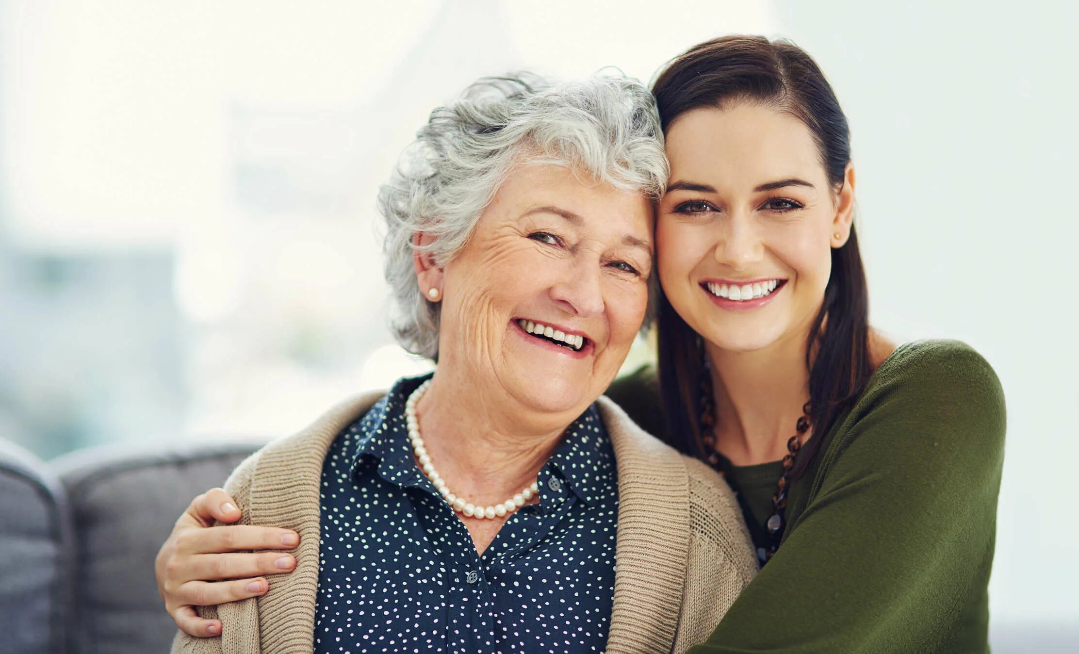 Women with daughter White background. Parents pay