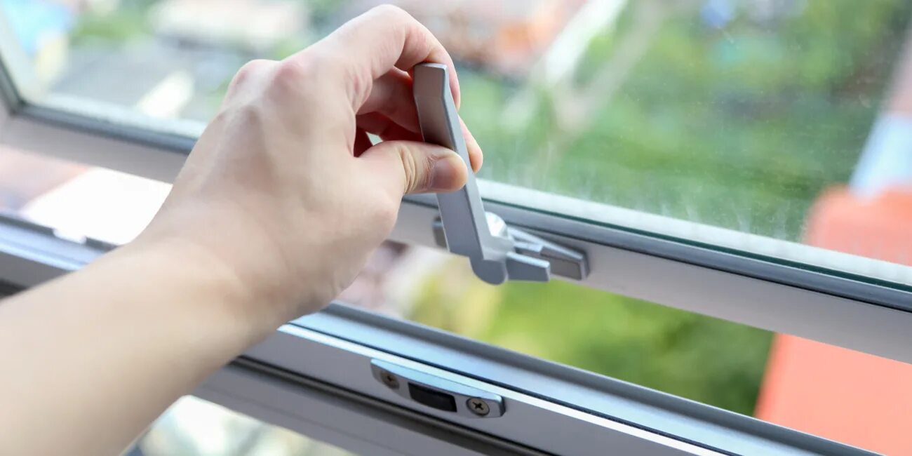 The window is open or opened. Awning window. window in hands.