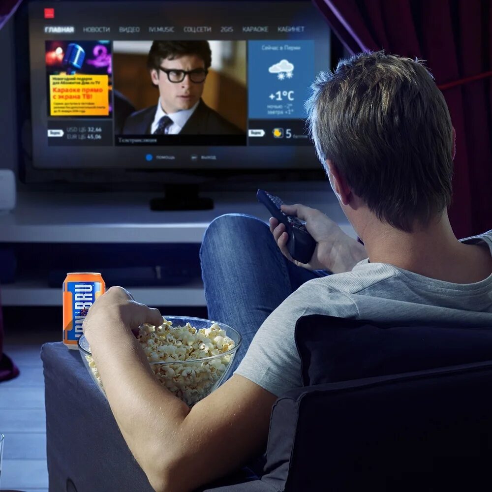 He is watching tv at the moment. Телевизор с фильмом. Перед телевизором. Телевизор вечер. Человек телевизор.