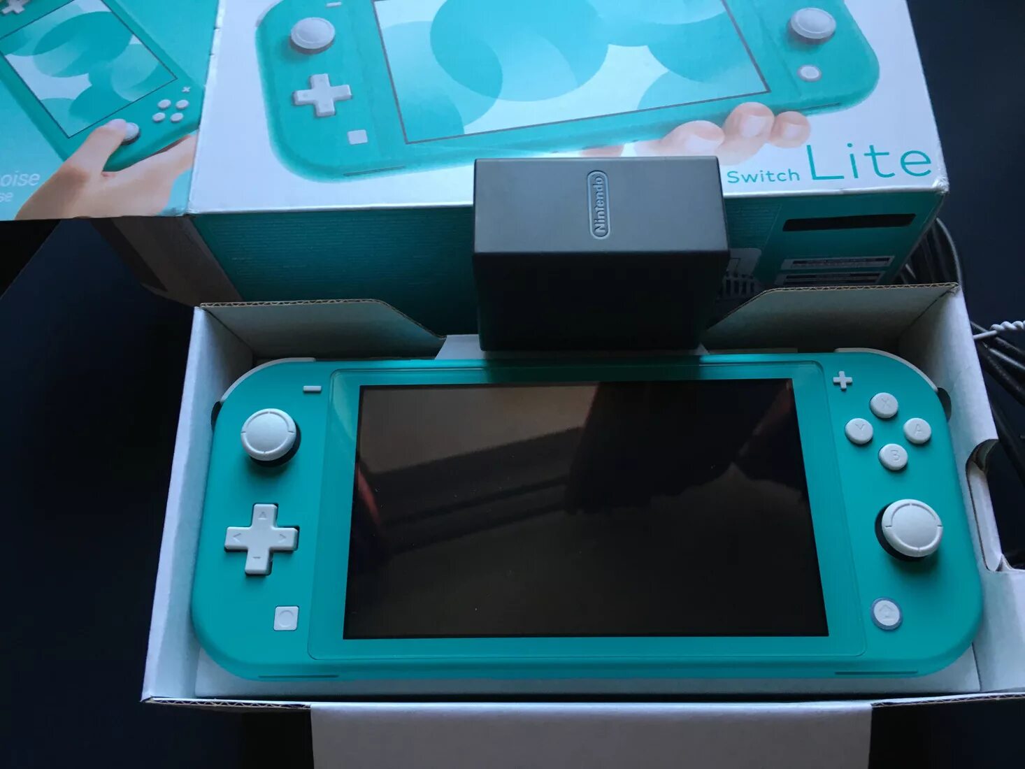 Nintendo lite приставка. Нинтендо свитч Лайт комплектация. Nintendo Switch Lite игры. Нинтендо свитч Лайт VR. Нинтендо свитч Лайт распаковка.