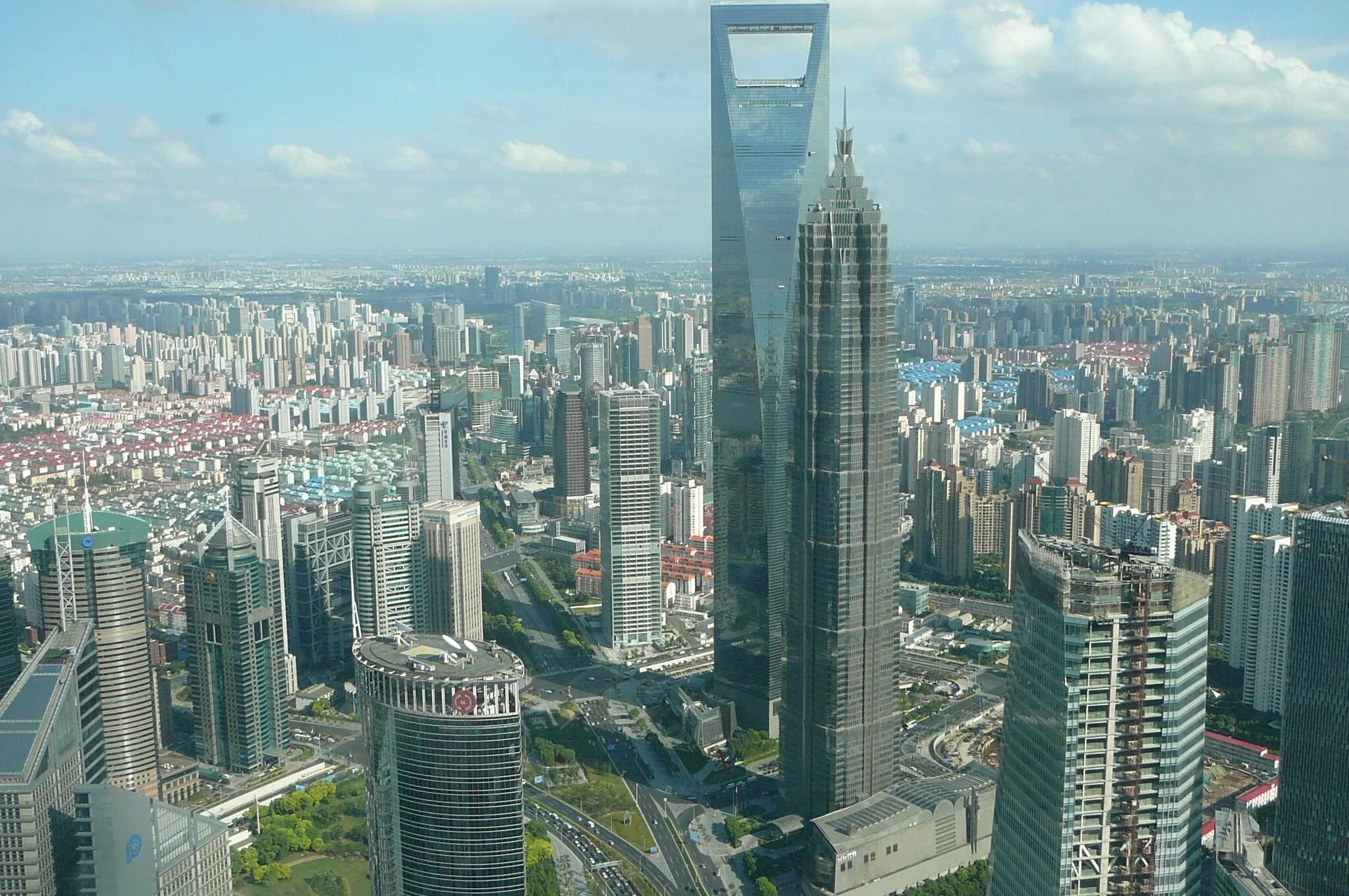Шанхай небоскребы. Китай Шанхай небоскребы. Шанхай высотки. Шанхай небоскрёбы Шанхая.