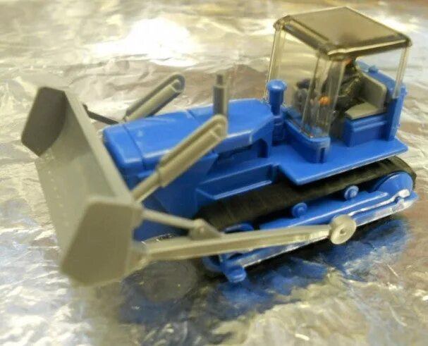 Д-290 бульдозер. Бульдозер caterpillar 2023. Бульдозер голубой. Синий бульдозер с ковшом. Включи бульдозер синий.