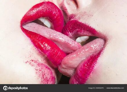 Lipstick lesbians kiss.