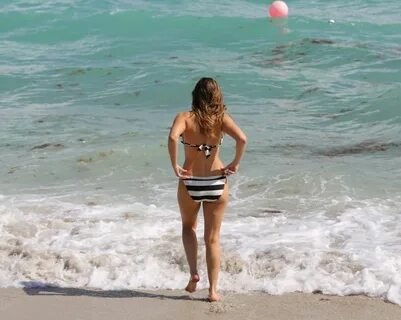 KELLY BROOK in Striped Bikini on the Beach In Miami.