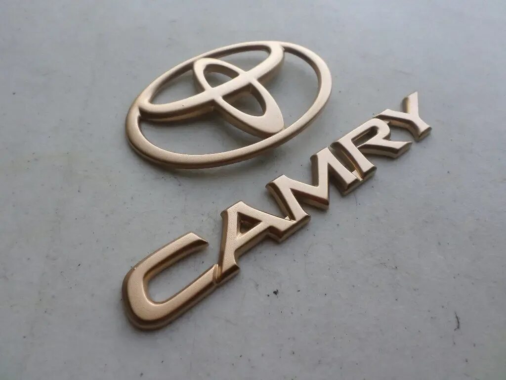 Тойота Камри лого. Логотип Тойота золото. Toyota Camry logo. Тойота Камри лого вектор. Значок камри 40