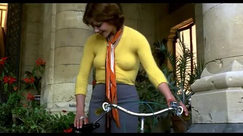 Tina Aumont in tight yellow sweater (Braless) Getting on a Bicycle 1080P BD...